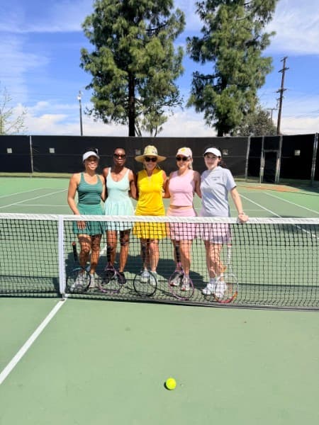 League players gathered at the net